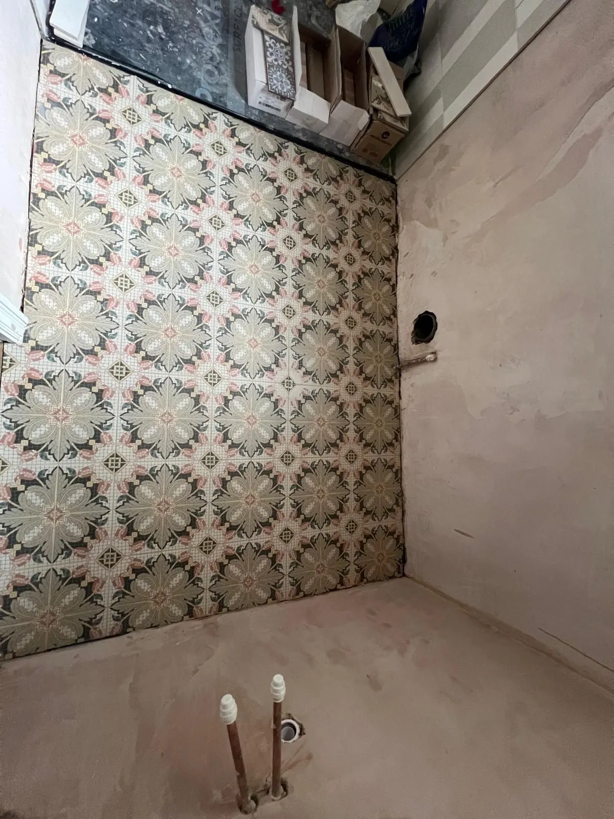 Green and pink patterned encaustic-style floor